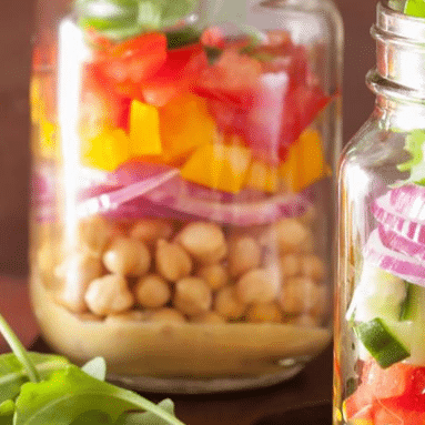 colorful layered salad in mason jars