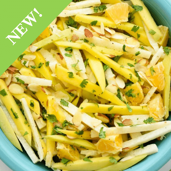 julienned summer fruit salad in aqua bowl with NEW sticker in the corner