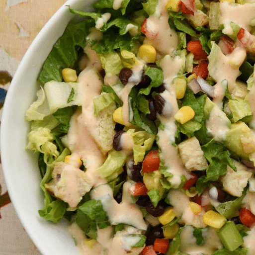 colorful salad close up in white bowl