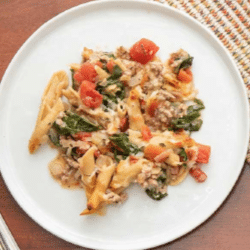 Top view of a pasta dish on a white plate