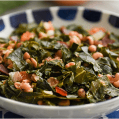 blue and white bowl of collared greens and black eyed peas