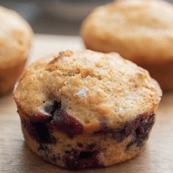 mini blueberry muffins on wooden cutting board